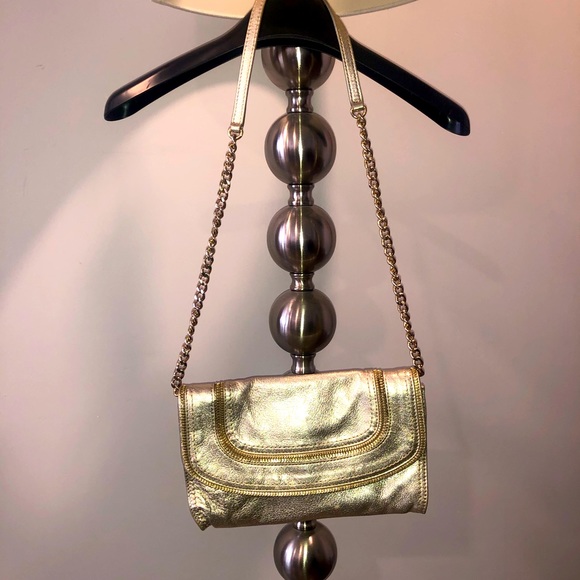 Michael Kors Handbags - Gold Michael Kors clutch with handle